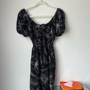 Stylish black and white dress from Charlotte Russe, with side openings.